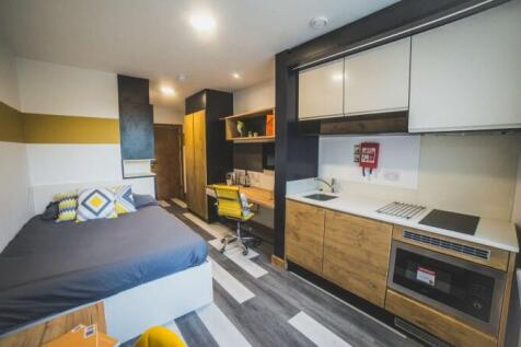Bright and modern student studio featuring a co...