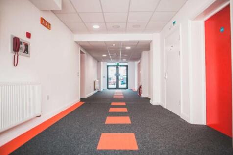 Bright and modern hallway with clean white wall...