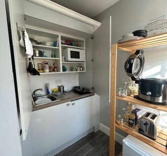 Compact and well-organised kitchenette featurin...