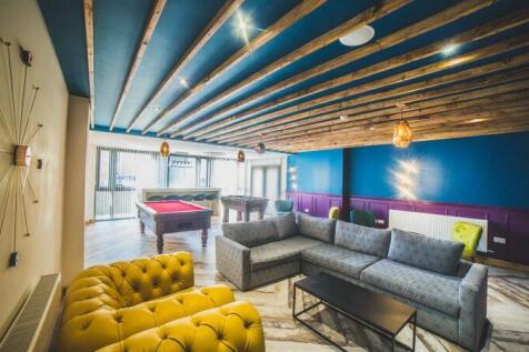 Spacious communal lounge featuring a stylish mi...