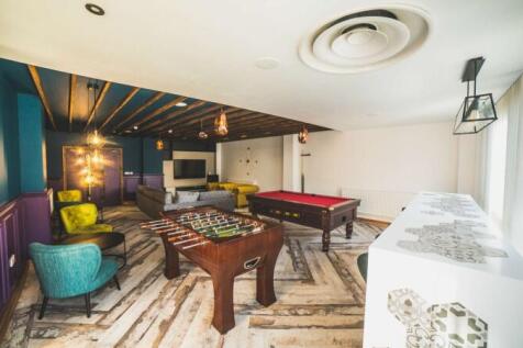 Bright and spacious communal lounge featuring a...