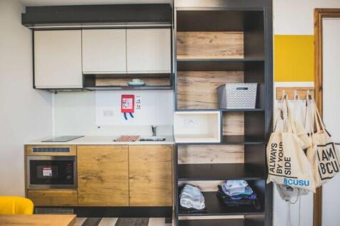 A bright and modern kitchenette featuring sleek...