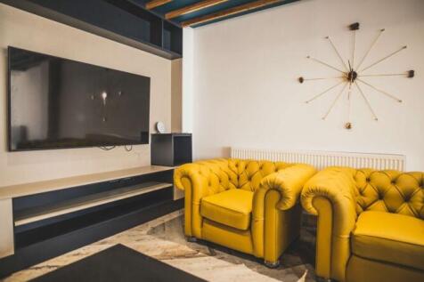 Contemporary living area featuring vibrant must...