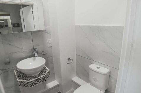 A modern and clean single toilet featuring styl...