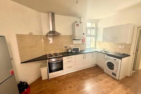 Bright and modern kitchen featuring ample count...