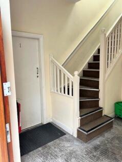 Bright and clean entrance area featuring a carp...