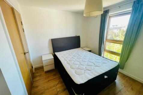 Bright and neat double bedroom featuring a comf...