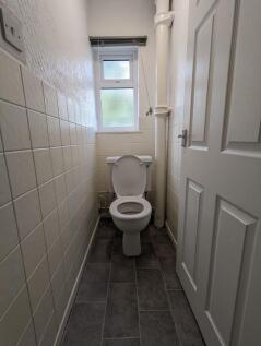 A clean and well-maintained single toilet room ...