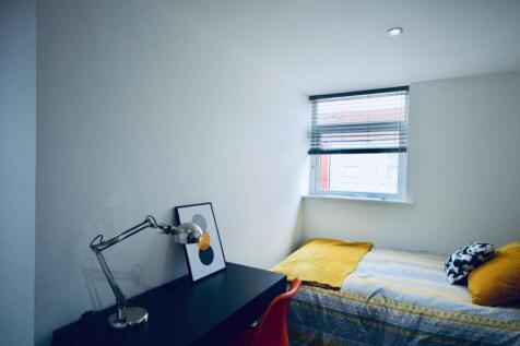Bright and cozy double bedroom featuring a comf...