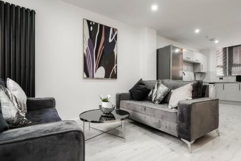 A stylish and modern living room featuring comf...