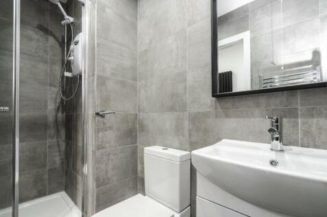 This modern bathroom features a sleek design wi...