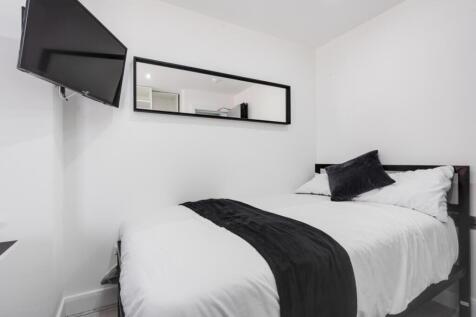 Cozy double bedroom featuring modern decor and ...