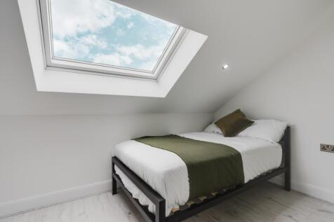 Bright and inviting double bedroom featuring a ...