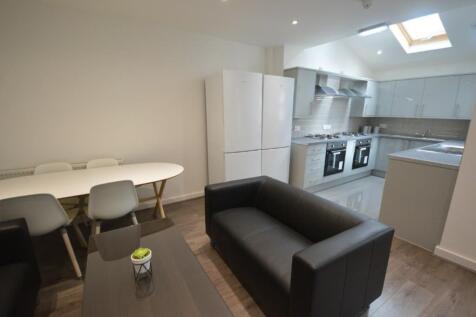 A modern and spacious kitchenette with ample st...