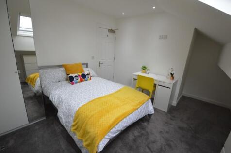 A bright and inviting double bedroom featuring ...