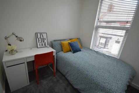 A bright and inviting double bedroom featuring ...