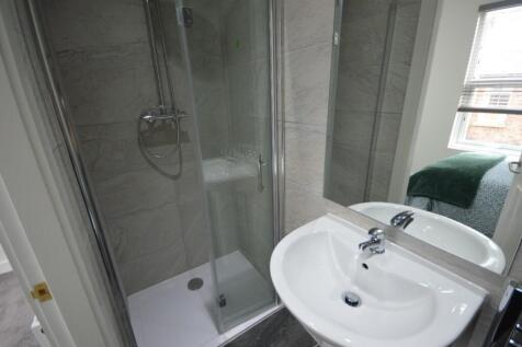 A modern and clean bathroom featuring a stylish...