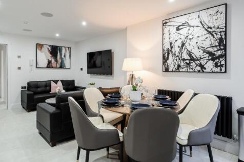 A stylish and modern living room featuring comf...