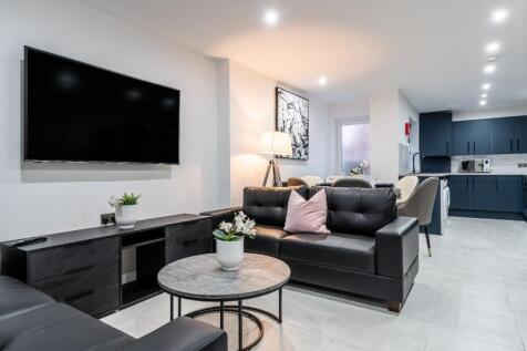 This inviting living room features modern decor...