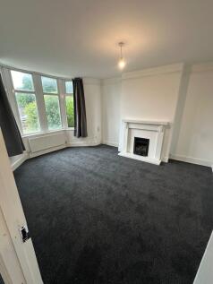 A bright and inviting living room featuring a l...