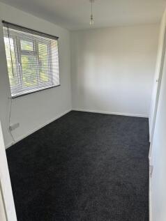 A neat and well-maintained single bedroom with ...