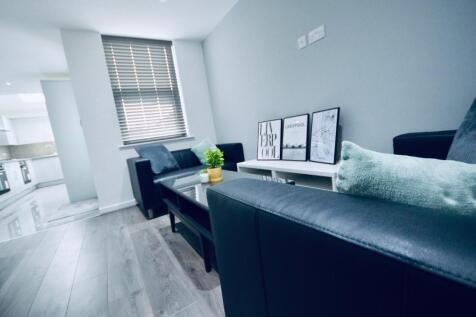 This inviting living room offers a cozy atmosph...