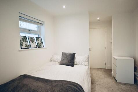 Bright and cozy double bedroom featuring a comf...