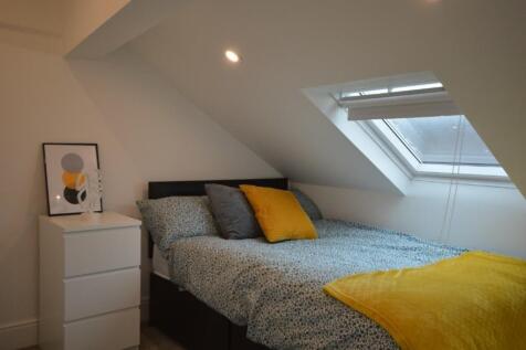 This charming double bedroom features a cozy la...