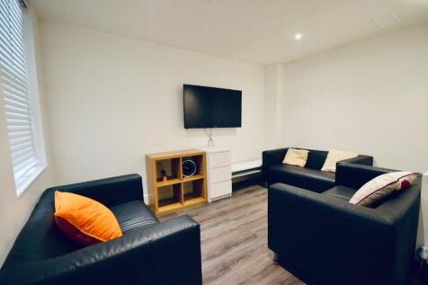 A stylish living room featuring comfortable sea...