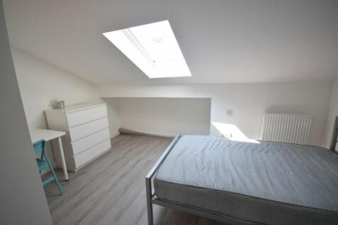 A bright and spacious double bedroom featuring ...