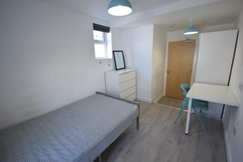 A bright and tidy double bedroom with modern fu...