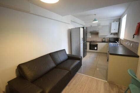 A modern and inviting kitchenette with ample sp...