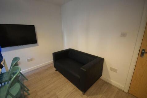 A cozy and modern living room with a sleek desi...