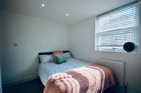 A beautifully designed double bedroom featuring...