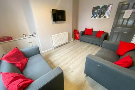A spacious and inviting modern living room, per...