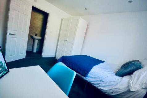 Bright and inviting double bedroom featuring a ...