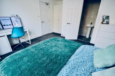 This stylish double bedroom features a comforta...