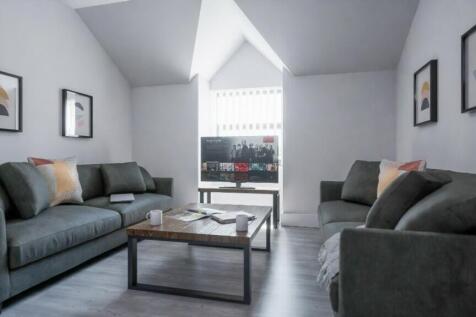 This contemporary living room features a stylis...