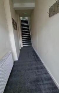 A clean and well-maintained hallway featuring n...