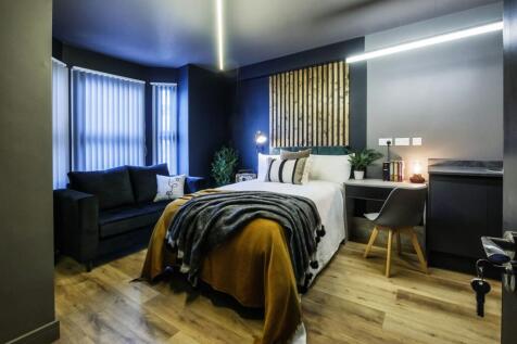 A stylish double bedroom featuring a cozy doubl...