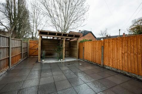 A neatly maintained, private outdoor garden are...