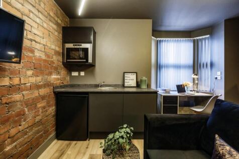 A contemporary living space featuring a stylish...
