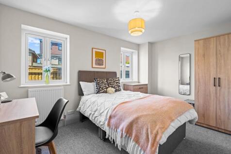 Bright and inviting double bedroom featuring a ...