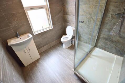 Bright, modern bathroom featuring a spacious wa...