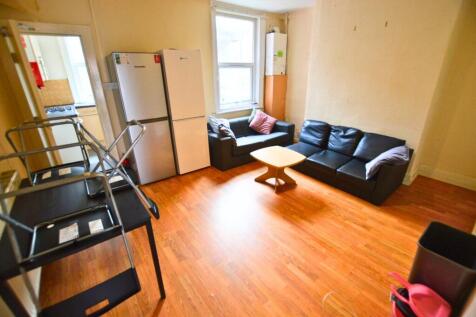 A cozy living room featuring two comfortable bl...
