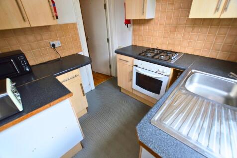 Compact kitchen with ample countertop space, mo...