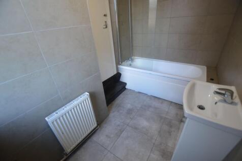 A clean and modern bathroom suite featuring a w...