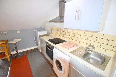 Bright and functional kitchen space featuring a...