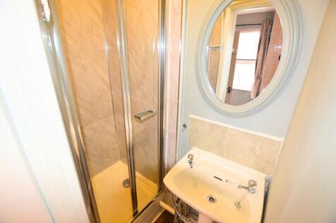 A neat and functional bathroom featuring a corn...