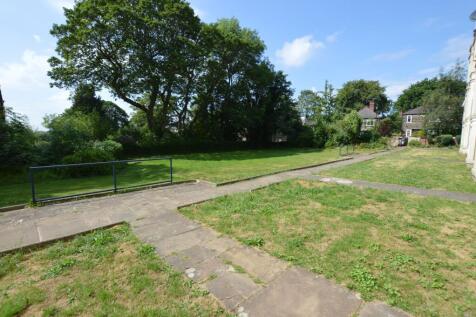 A spacious and well-maintained garden area feat...